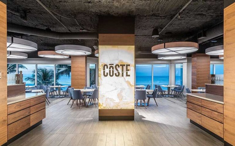 on site restaurant coste with dining area lobby at diamondhead beach resort fort myers