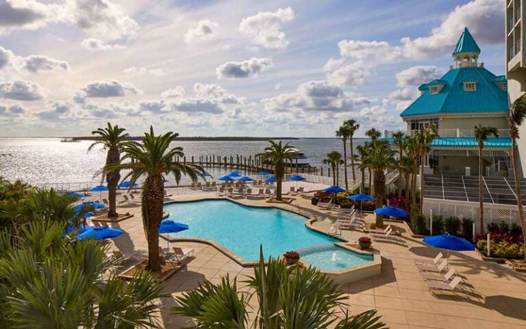 outdoor pool daytime with pier and keys on water at marriott sanibel harbour resort spa fort myers