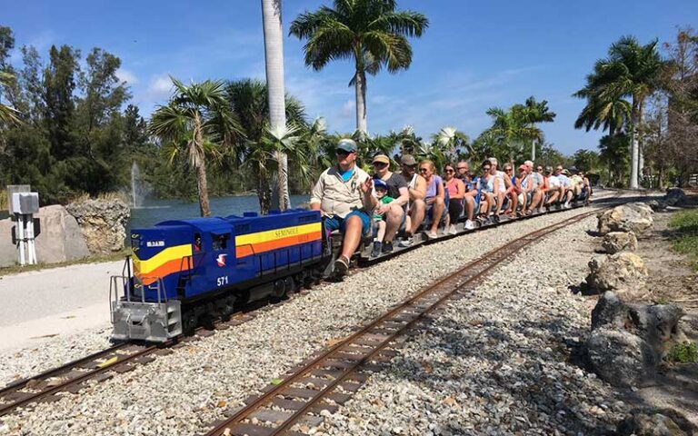 patrons riding mini train on tracks at railroad museum of south florida fort myers
