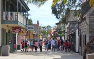 pedestrians strolling along walking street with historic buildings at st george street st augustine