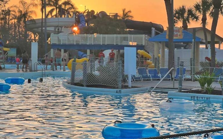 pool and rides with tubes and sunset behind slides at sun splash family waterpark fort myers