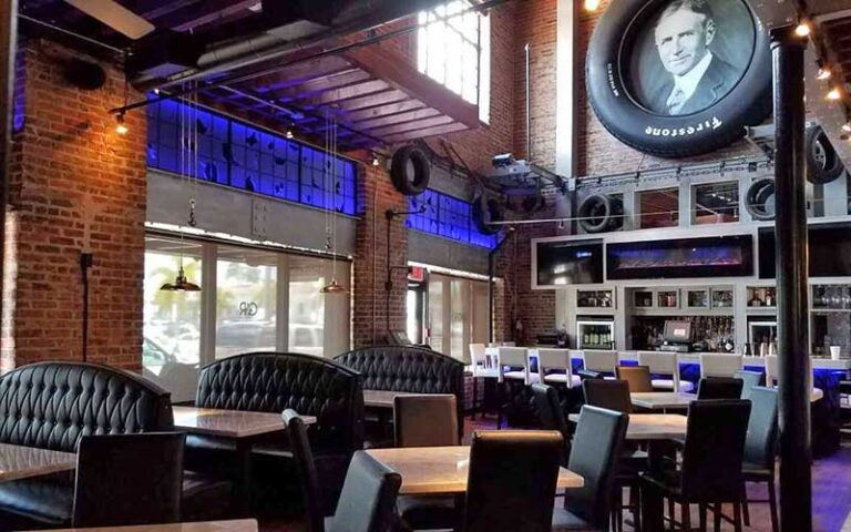 restaurant interior with seating and tires decorating walls at the firestone fort myers