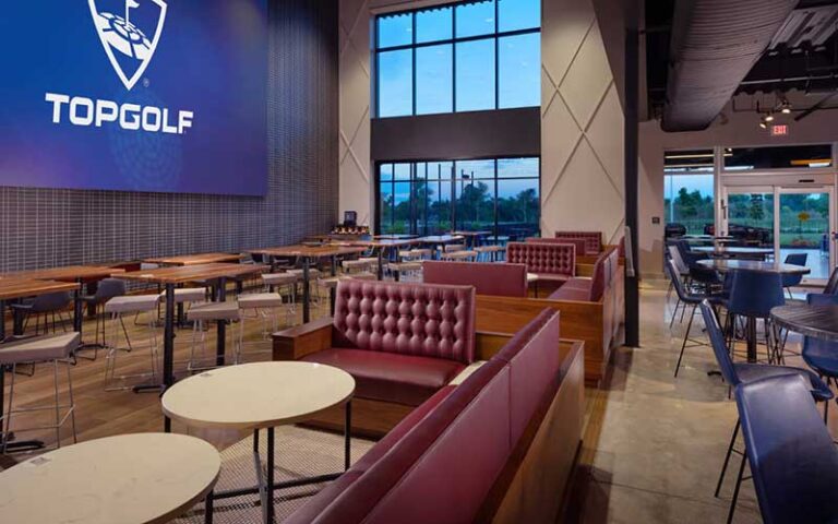 restaurant lounge area with view at topgolf fort myers