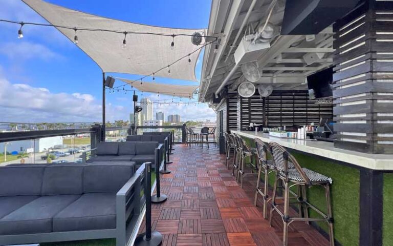 rooftop bar and seating with city view at the firestone fort myers