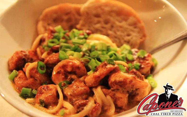 shrimp pasta dish with bread at capones coal fire pizza fort myers