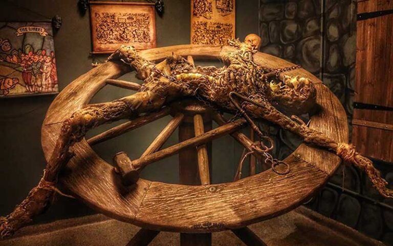 skeleton stretched out on wheel shaped rack at medieval torture museum st augustine