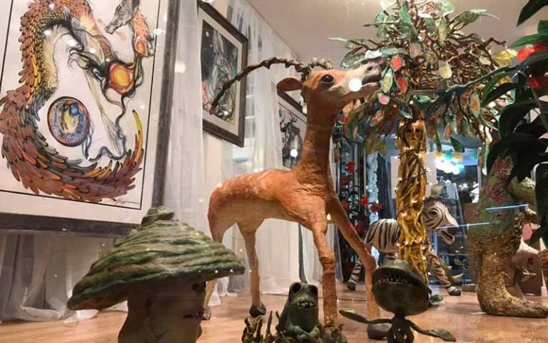 statues and canvas art on display at the franklin shops fort myers