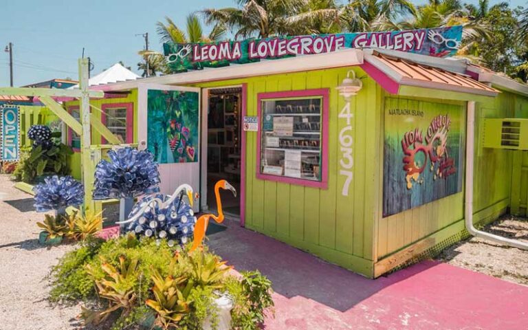 storefront entrance gallery with colorful art and flamingo at matlacha art district fort myers