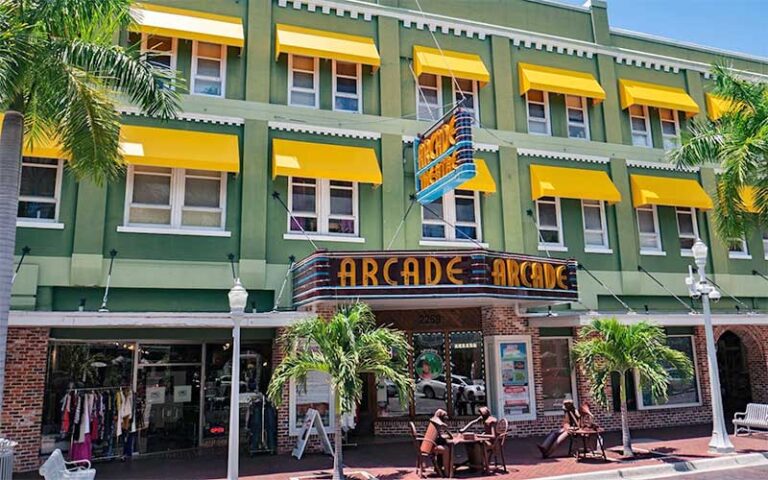 street front exterior with green and yellow building and arcade theater marquee sign at florida repertory theatre fort myers