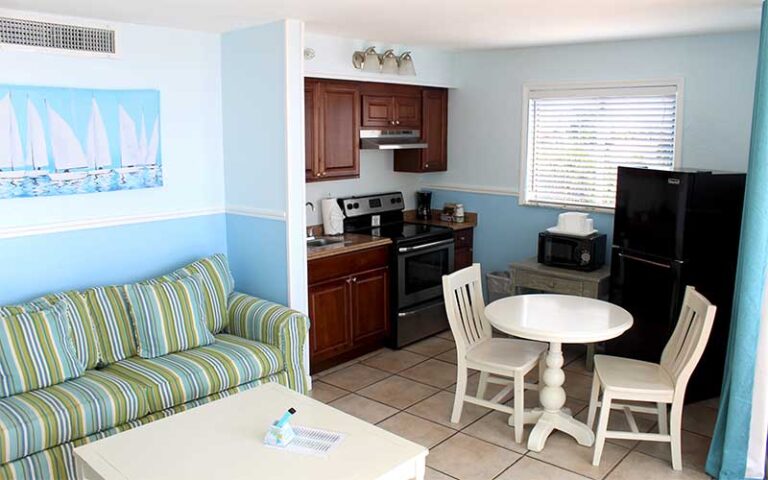 suite interior with island decor sofa and kitchen at lana kai island resort fort myers beach