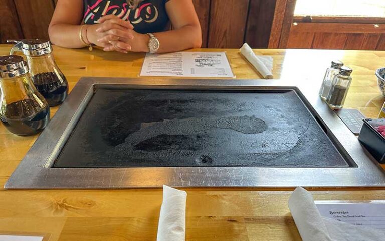 table top griddle with syrup bottles at old sugar mill pancake house de leon springs