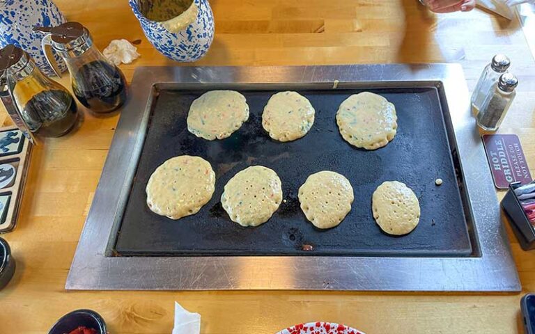 tabletop griddle with pancakes poured out at old sugar mill pancake house de leon springs