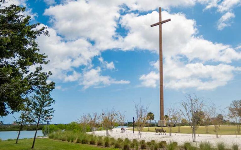 towering cross on hill with landscaped path around at national shrine of our lady of la leche st augustine
