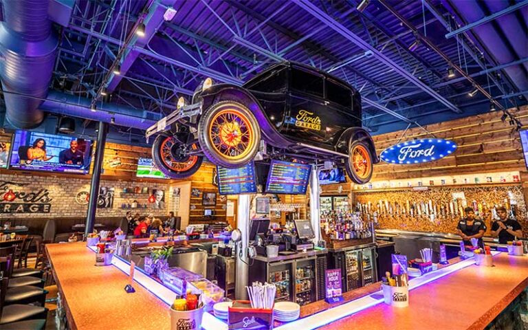 vibrant bar with model t antique car mounted above at fords garage fort myers