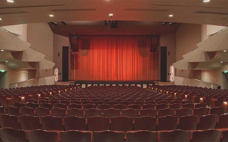 view from back of stage and red curtain at barbara b mann performing arts hall fort myers