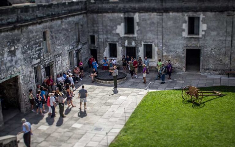 view from wall of tour group in courtyard at castillo de san marcos st augustine
