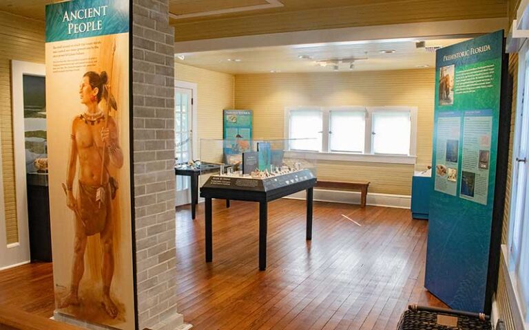 wood paneled interior of house with indian exhibits at mound house at fort myers beach