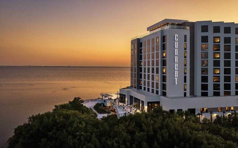 aerial exterior of hotel with sign and sunset bay view at the current hotel tampa