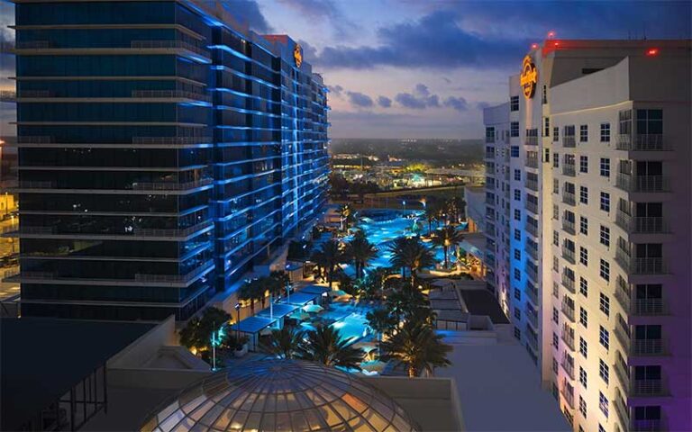 aerial night view of hotel buildings with pool between at seminole hard rock hotel casino tampa