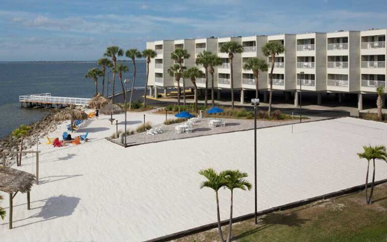 aerial of private beach with volleyball at sailport waterfront suites tampa