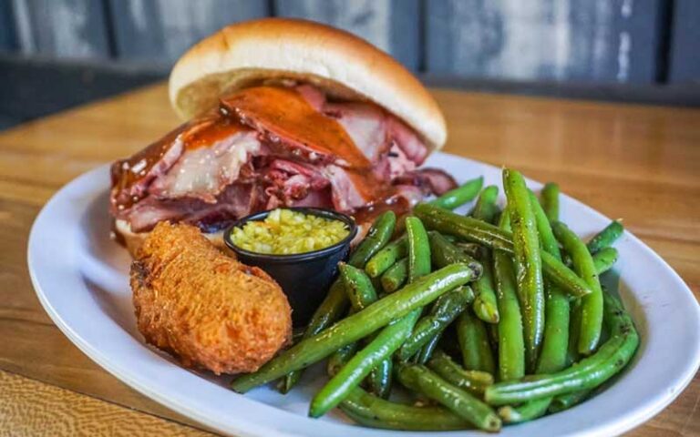 barbecue brisket sandwich with hushpuppy and green beans at jimbos pit bar b q tampa