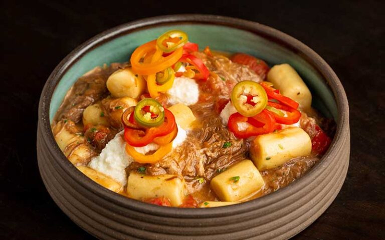 chili with colorful garnish at rooster the till tampa