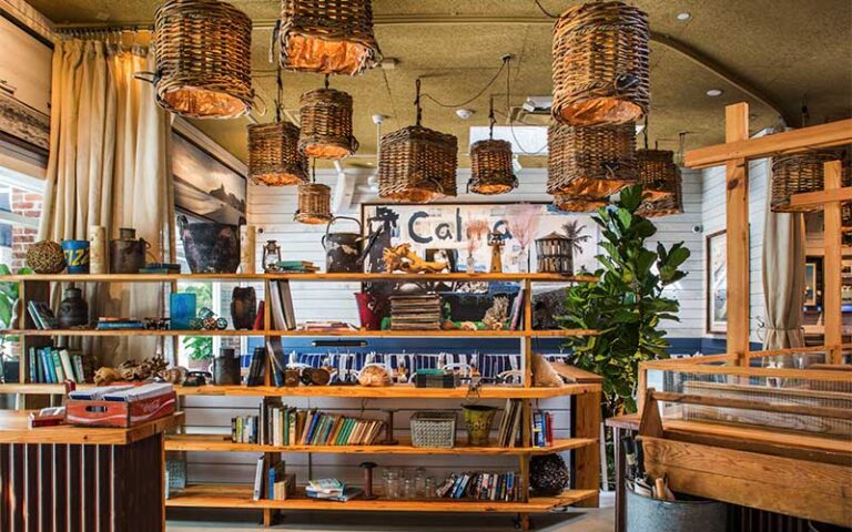 coastal rustic decor dining area with book shelf at bartaco tampa