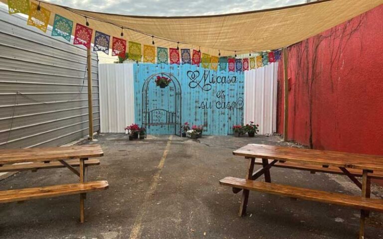 colorful seating patio with sunshade at nachos tacos tampa