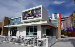 corner exterior of restaurant with outdoor seating at sugar factory icon park orlando