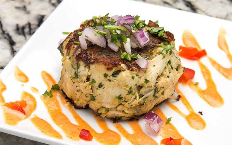 crab cake with garnish at miguelitos taqueria y tequilas tampa