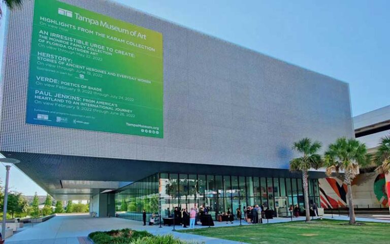 daytime exterior of modern museum building with banner at tampa museum of art