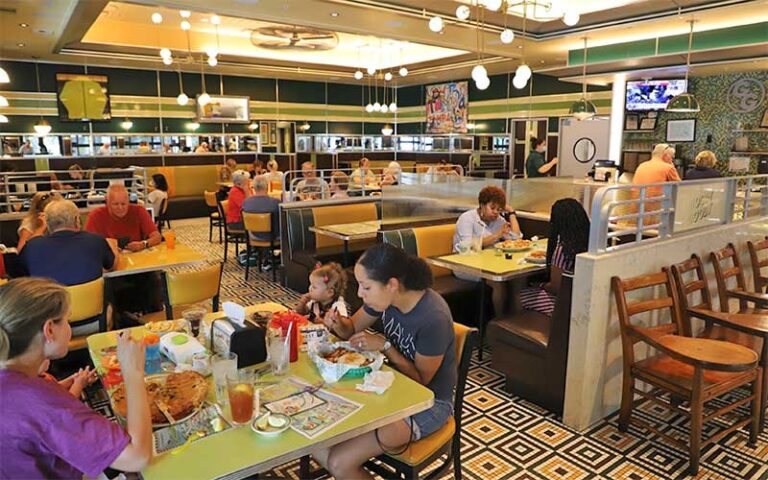 dining area with crowded tables and retro decor at goody goody burgers tampa
