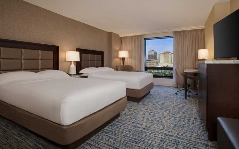 double bed guestroom with city skyline view at hilton tampa downtown