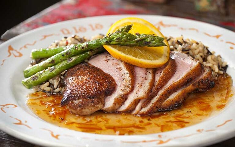 duck breast entree with asparagus at ulele tampa