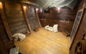 empty room in boat hold with pirate theme at escape room adventures fort myers