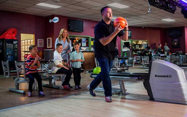 family cheering dad about to bowl at sarasota lanes bowling