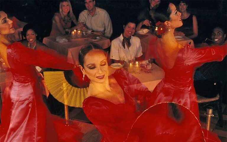 flamenco dancers in red dresses performing around diners at columbia restaurant ybor city tampa