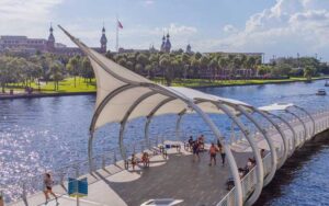 floating bridge walkway along river with sunshade at tampa riverwalk