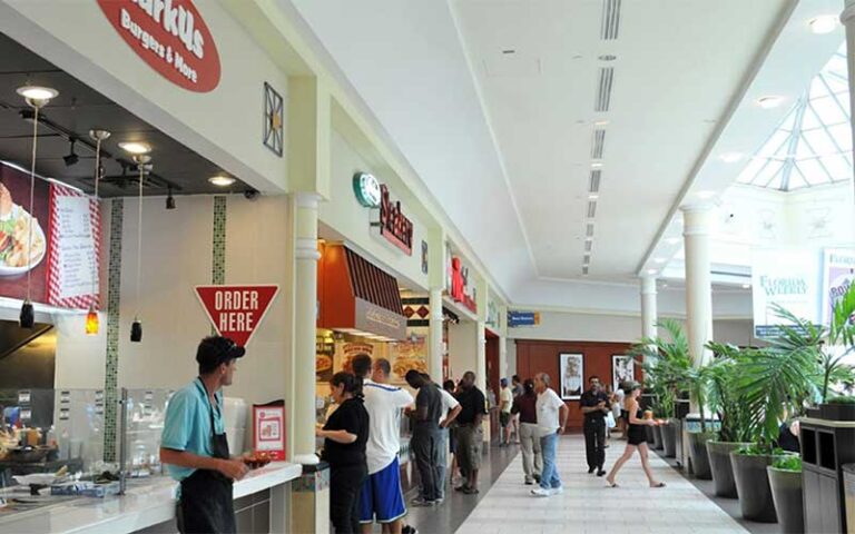 food court area with vendors and atrium at edison mall fort myers