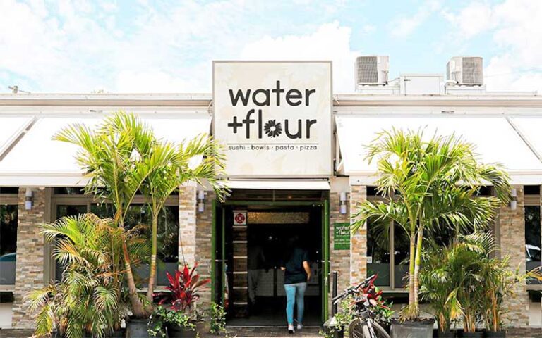 front exterior daylight with awnings and sign at water flour tampa