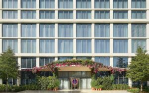 front of hotel with multiple story windows and entrance at the tampa edition