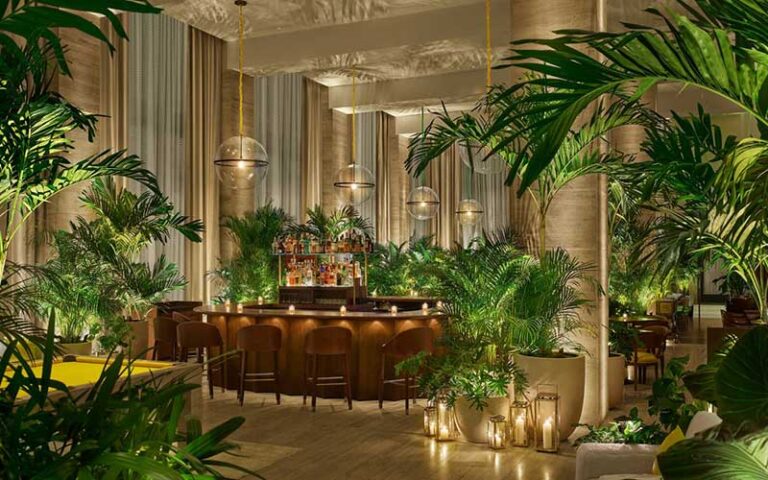 gold and tropical plants in lobby bar at the tampa edition
