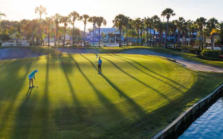 golfers on course with early sun at saddlebrook resort tampa
