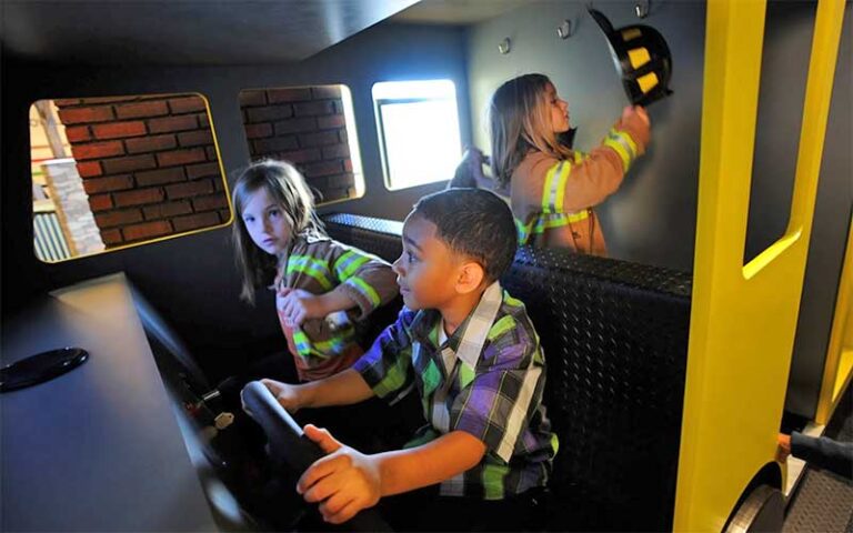 kids playing in fire truck exhibit at glazer childrens museum tampa