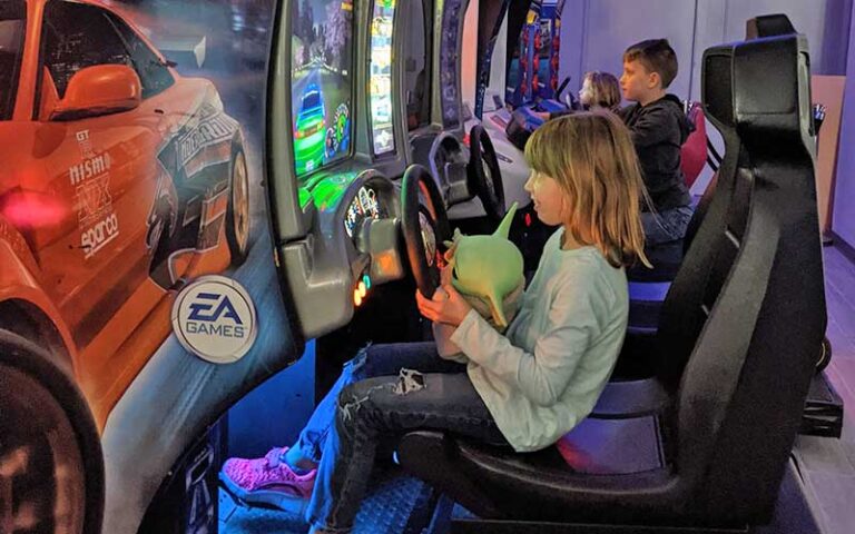 kids playing race car games at retro zone arcade fort myers