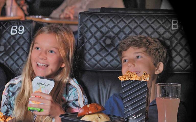 kids watching movie with snacks at cmx cinebistro siesta key sarasota