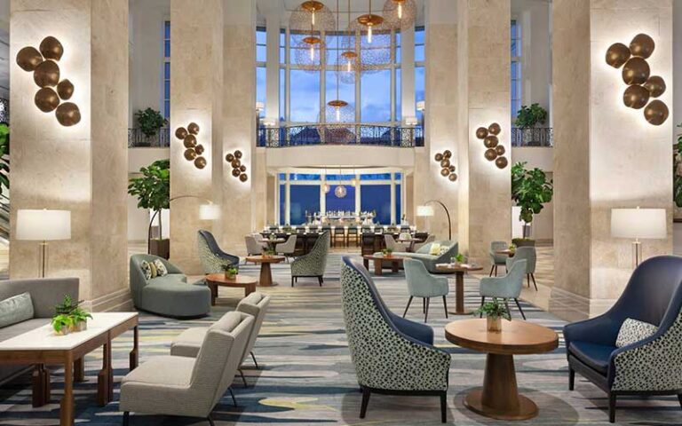 lobby with columns and cathedral ceiling atrium at tampa marriott water street