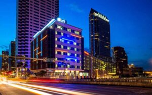 modern high rise street view at night at aloft tampa downtown