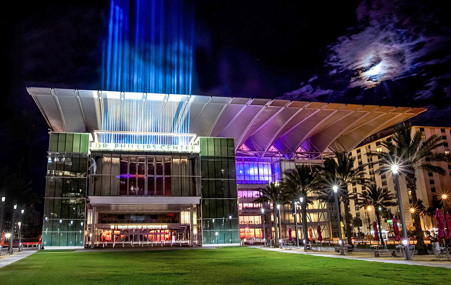 modern theater building at night with dramatic lighting and moonlight at dr phillips center for the performing arts orlando