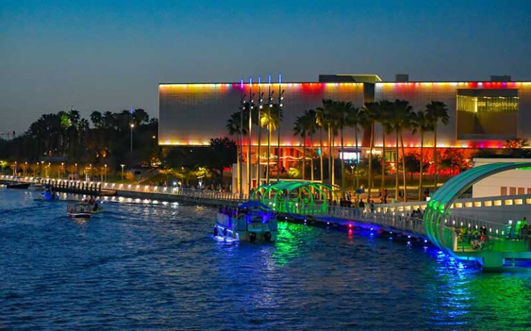 night view of museum along river with colorful lighting at tampa museum of art